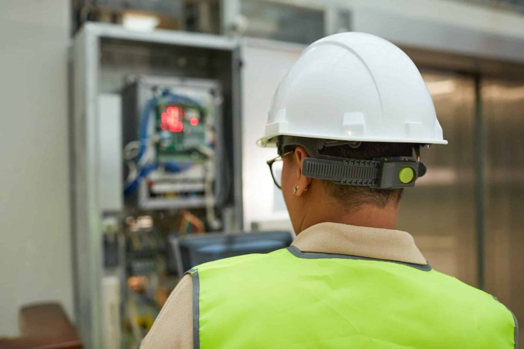 Female Worker Checking Electric Systems