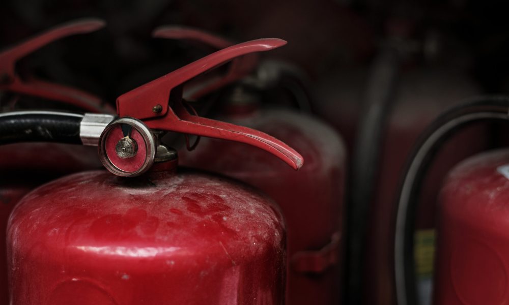 Closeup of red fire extinguishers